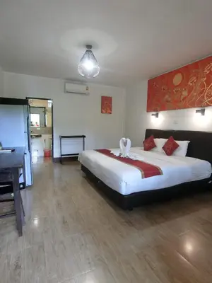 a large bedroom with a large bed and a desk at The Krabi Forest Homestay in Ao Nang Beach