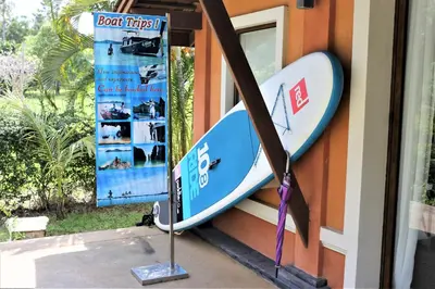 a surfboard is attached to the side of a building at Laguna Villas Boutique Hotel in Ko Yao Noi
