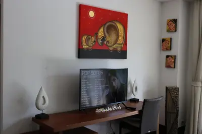 a desk in a room with a picture on the wall at Laguna Villas Boutique Hotel in Ko Yao Noi