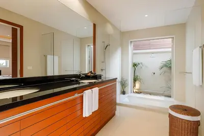 a bathroom with a sink and a large mirror at The Residence Bantao Villa unit 121 in Bang Tao Beach