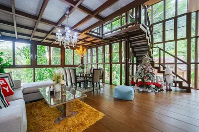 a large living room with a christmas tree in it at Thai Modern Resort & Spa 