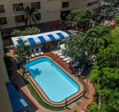 an overhead view of a swimming pool at a hotel at PorterHouse Beach Hotel in Patong Beach
