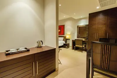 a hotel room with a reception desk and a bedroom at Dahlia 2 Bedroom Amazing Seaview in Rawai Beach