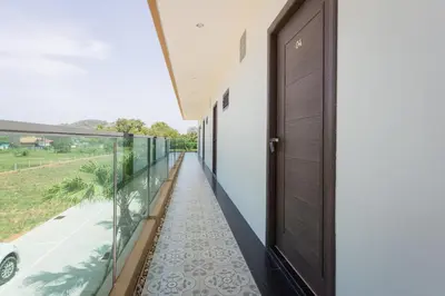 a corridor of a house with a door and a balcony at Journey Residence Phuket in Bang Tao Beach