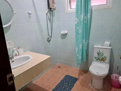 a bathroom with a sink and a toilet and a shower at 2 bedroom bungalow Nai Harn 4 Resort in Ban Suan