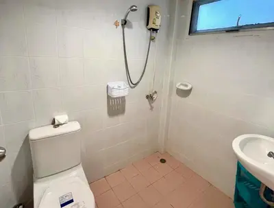 a bathroom with a shower and a toilet and a sink at 2 bedroom bungalow Nai Harn 4 Resort in Ban Suan