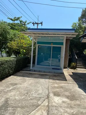 a small house with a blue front door at Ban Tidlay - SHA in Ko Yao Noi