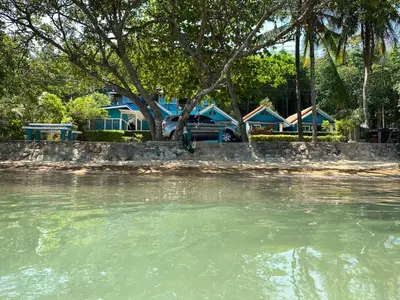 a body of water with a group of houses at Ban Tidlay - SHA in Ko Yao Noi