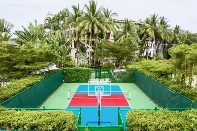 an aerial view of a tennis court in a resort at Marriott's Mai Khao Resort - Phuket in Mai Khao Beach