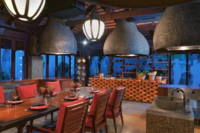 a dining room with a table and chairs at Marriott's Phuket Beach Club in Mai Khao Beach