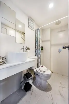 a bathroom with a toilet and a sink at Thai Kamala Beach Front in Kamala Beach