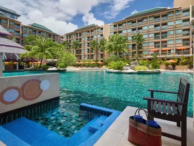 a pool at a hotel with a resort at Novotel Phuket Vintage Park Resort in Patong Beach