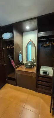 a bathroom with a sink and a mirror at Suuko Villas in Chalong
