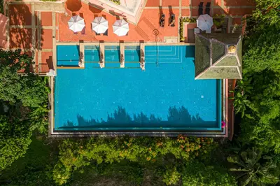 an overhead view of a swimming pool in front of a house at Suuko Villas in Chalong