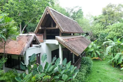 a house with two roofs on the side of it at Suuko Villas in Chalong