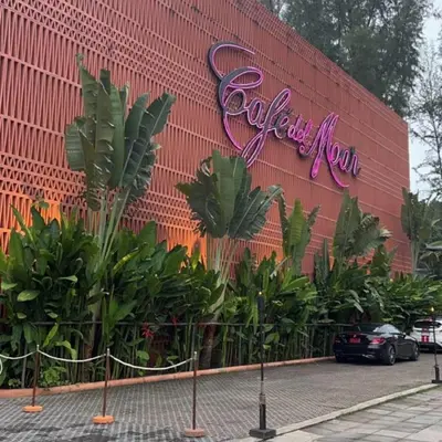 a building with a sign that reads california mom at Beachfront pool villa in Kamala Beach