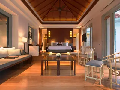 a living room with a bed and a couch at Amatara Welleisure Resort in Panwa Beach