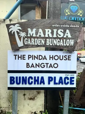 a sign for a marinara garden tavernatown sidx sidx sidx at Buncha Place in Bang Tao Beach