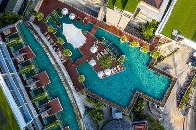 an overhead view of a swimming pool at a resort at Kalima Resort and Spa in Patong Beach