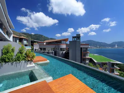 a view of a building with a swimming pool at Kalima Resort and Spa in Patong Beach