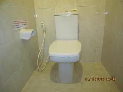 a bathroom with a white toilet in a stall at Popeye Guesthouse in Ao Nang Beach