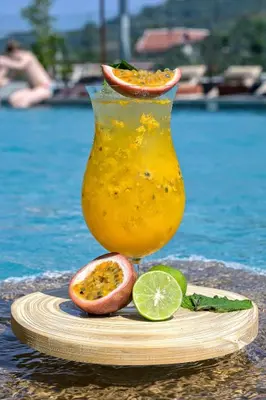 a drink in a vase with a slice of lime at Zenseana Resort & Spa - Patong, Phuket in Patong Beach