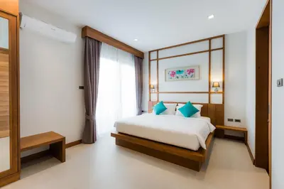 a bedroom with a bed and a window at Villa Palavee (B1) in Ao Nang Beach