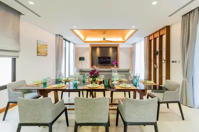 a dining room with a table and chairs at Villa Palavee (B1) in Ao Nang Beach