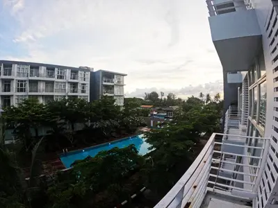 a view from the balcony of a building with a swimming pool at At Seacondo-Excellent-B26 in Klong Muang Beach