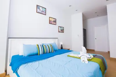 a bedroom with a blue bed with an elephant on it at At Seacondo-1 Bedroom-A20 in Klong Muang Beach