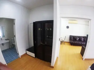 a living room with a black cabinet and a couch at At Seacondo-1 Bedroom-A20 in Klong Muang Beach