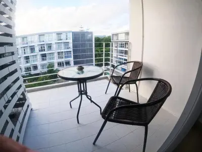 a balcony with two chairs and a table on a balcony at At Seacondo-1 Bedroom-A20 in Klong Muang Beach