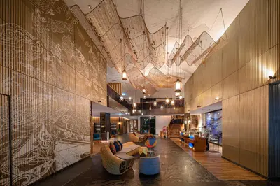 a large lobby with couches and a chandelier at Hotel Indigo Phuket Patong by IHG in Patong Beach