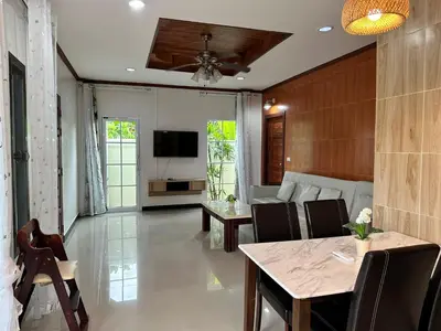 a living room with a table and a couch at 3BR Villa near Laguna beach in Bang Tao Beach