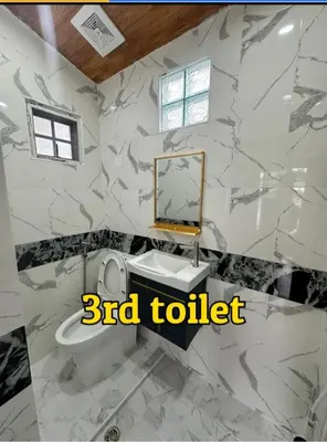 a bathroom with a toilet and a sink and a mirror at 3BR Villa near Laguna beach in Bang Tao Beach