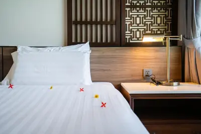 a bedroom with a bed with stars on it at Le Resort and Villas in Rawai Beach