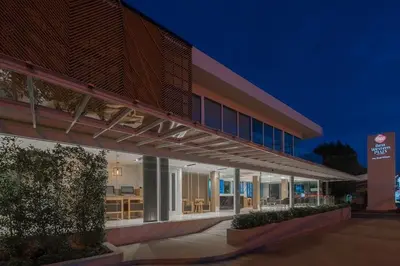 an external view of a building at night at The Beachfront Hotel Phuket in Rawai Beach