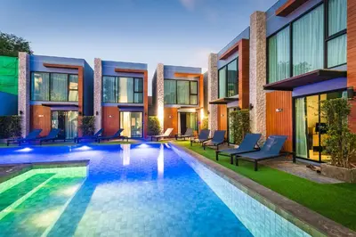 an image of a swimming pool in front of a building at Peace Blue Naiharn Naturist Resort Phuket SHA Extra Plus in Rawai Beach