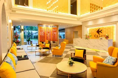 a lobby of a hotel with chairs and tables at CRAFT Resort & Villas, Phuket Town - scheduled shuttle to Phuket Old Town in Phuket Town