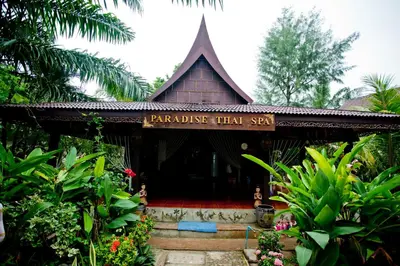 a building with a sign that says paradise that san at Paradise Pearl Bungalows in Phi Phi Don
