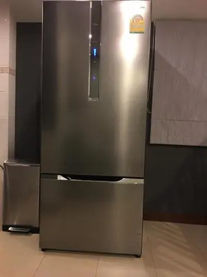 a stainless steel refrigerator sitting in a kitchen at Beautiful 3 Bedroom Garden Villa in Chalong