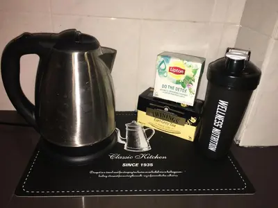 a coffeemaker with a coffee pot and a box of coffee at Beautiful 3 Bedroom Garden Villa in Chalong