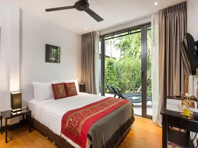 a bedroom with a bed and a large window at Infinity Blue Phuket by Elite Havens in Natai Beach