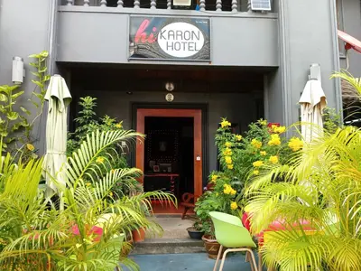 a front entrance to a hotel with plants at Hi Karon Beach in Karon Beach