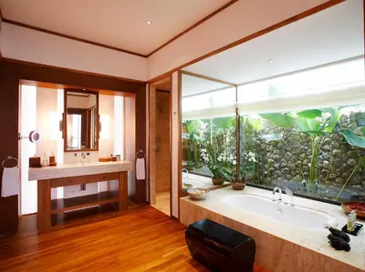 a bathroom with a large tub and an aquarium at Villa Nandana by Elite Havens in Natai Beach