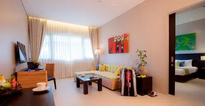 a living room with a couch and a table at Thanyapura Sports & Health Resort in Thalang