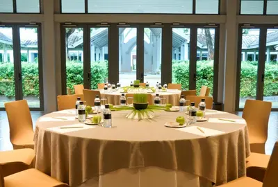 a conference room with a round table and chairs at Thanyapura Sports & Health Resort in Thalang