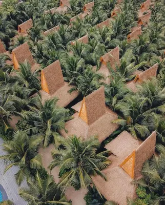 an overhead view of a jungle with palm trees and buildings at Phi Phi CoCo Beach Resort in Phi Phi Don