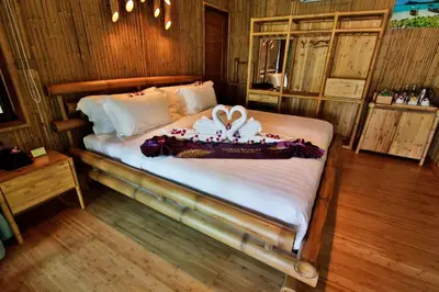 a bedroom with a bed with a box on it at Phi Phi CoCo Beach Resort in Phi Phi Don