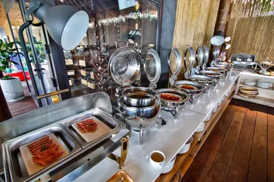 a buffet line of food in a restaurant at Phi Phi CoCo Beach Resort in Phi Phi Don